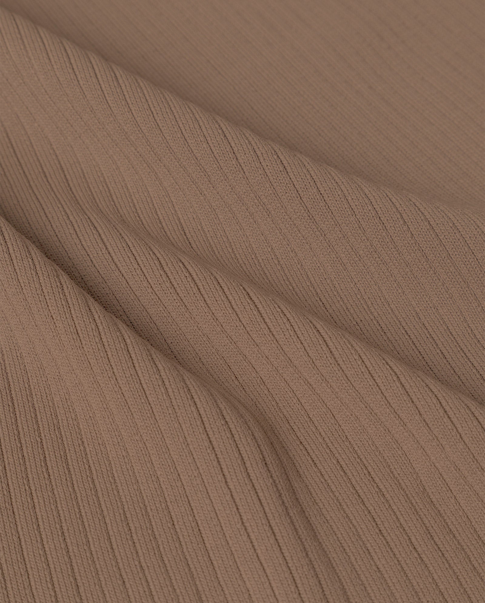 Close-up of ribbed brown fabric with visible texture and diagonal folds, showcasing the signature rib structure of the IVY OAK KLAUDIA Dress.