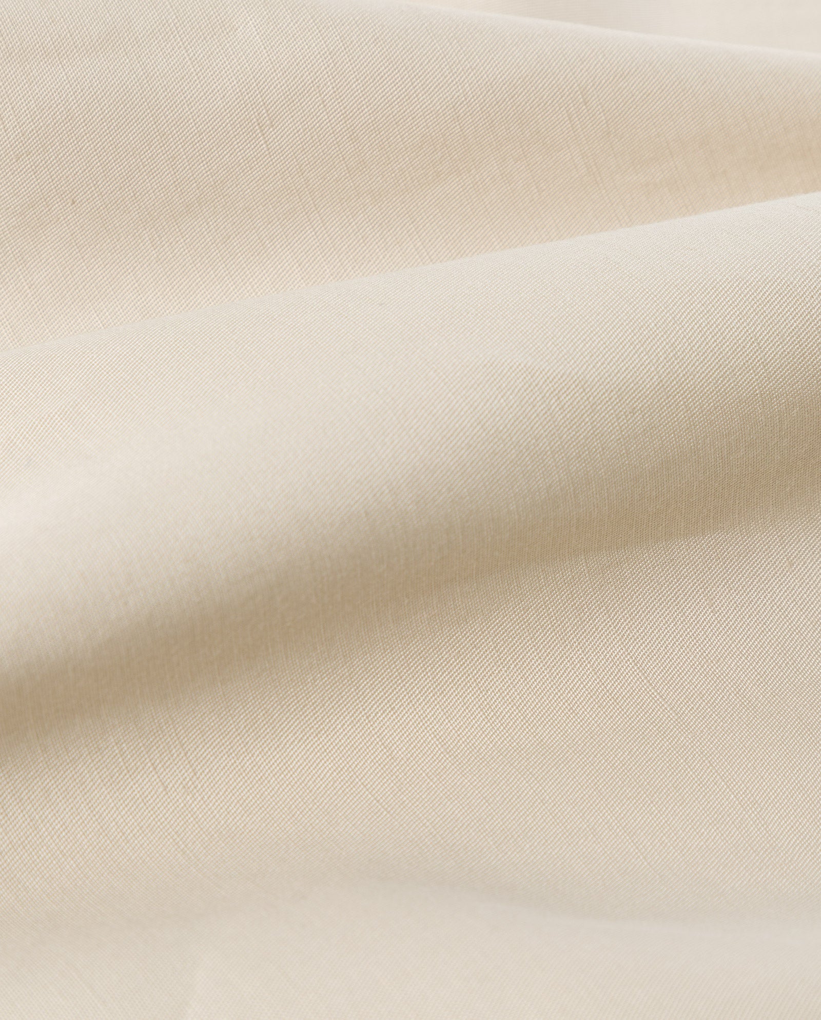 Cream-colored linen blend fabric with soft folds and a smooth, slightly textured surface—ideal for the IVY OAK MANILA Dress or a sleeveless maxi dress.