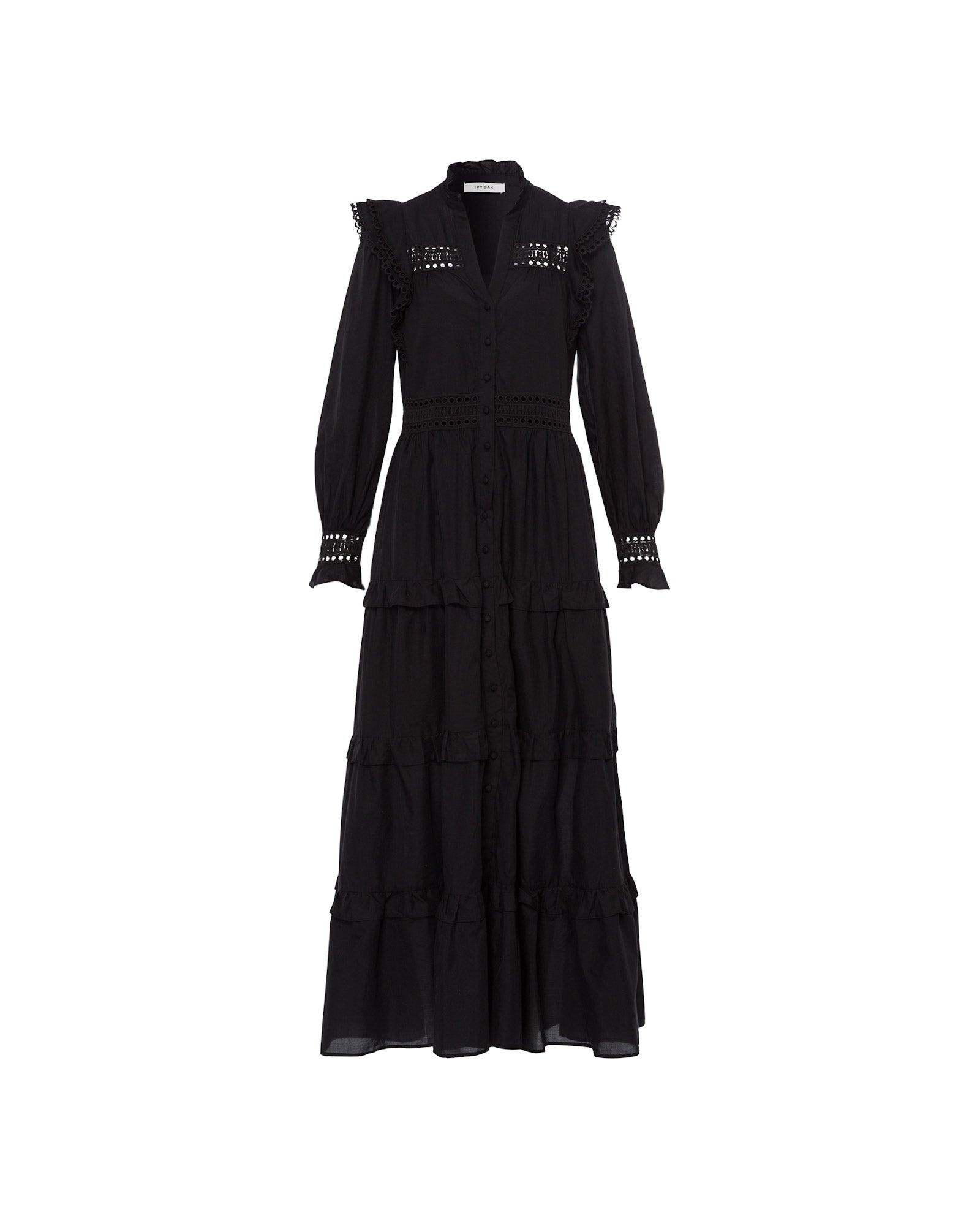The DENISA Dress by IVY OAK is a long black cotton voile dress featuring ruffled hems, lace tape details, and long sleeves, shown against a white background.