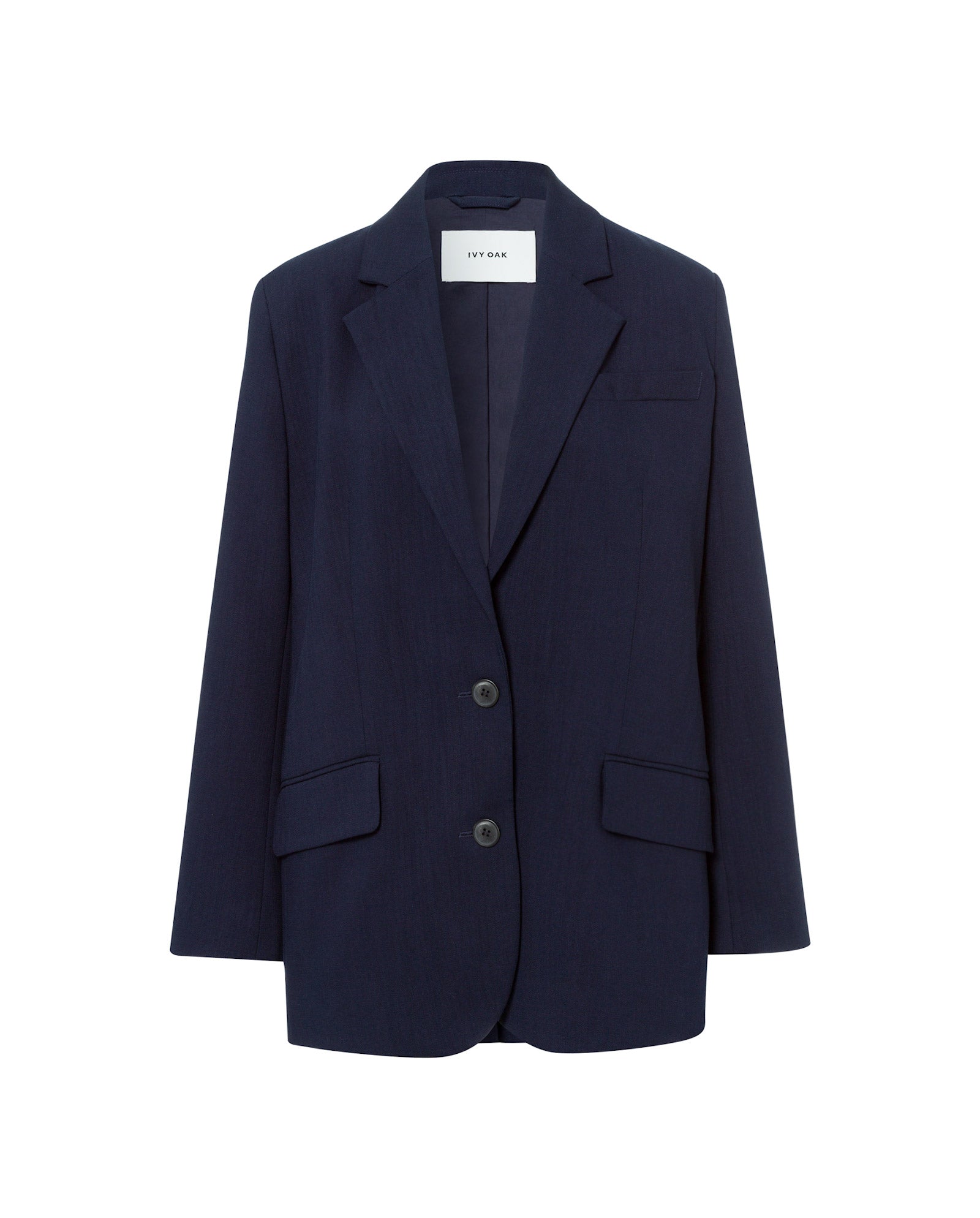 The IVY OAK JUNA Blazer, a navy blue oversized design with two buttons and front pockets, is shown against a plain white background.