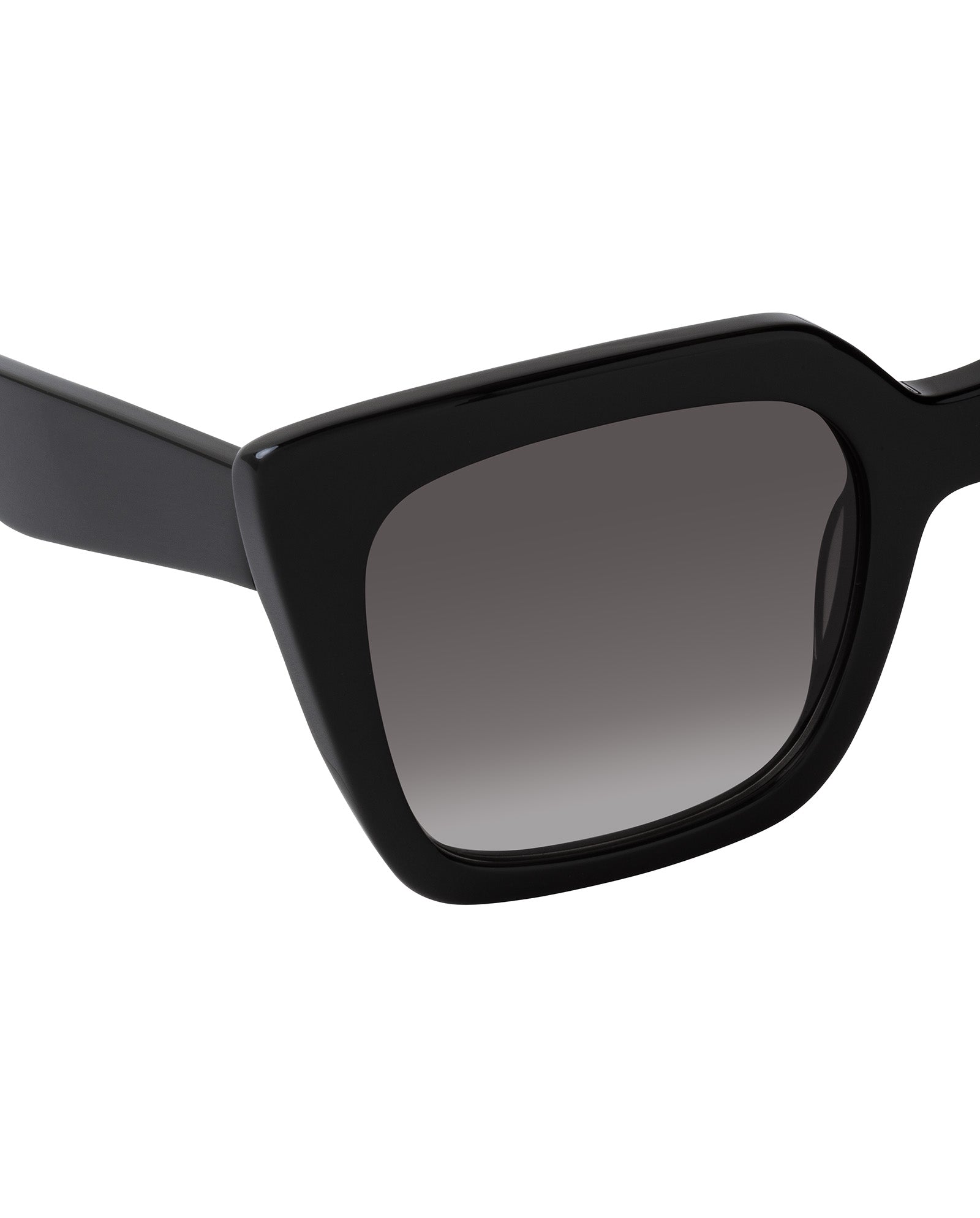 Close-up of IVY OAK Adelaine Sunglasses—black biodegradable acetate with thick frames and dark gradient lenses—set against a white background.