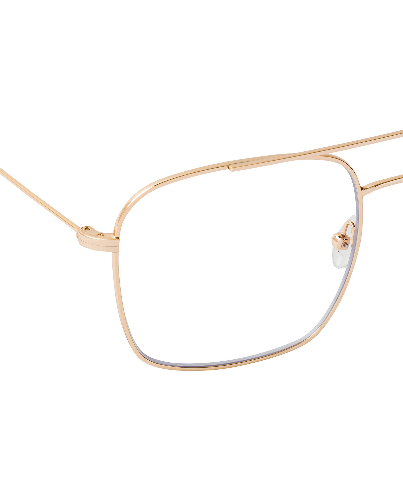 Close-up of Augusta Glasses by IVY OAK: gold wireframe, rectangular lenses, clear nose pads, and retro style with subtle 70s references.