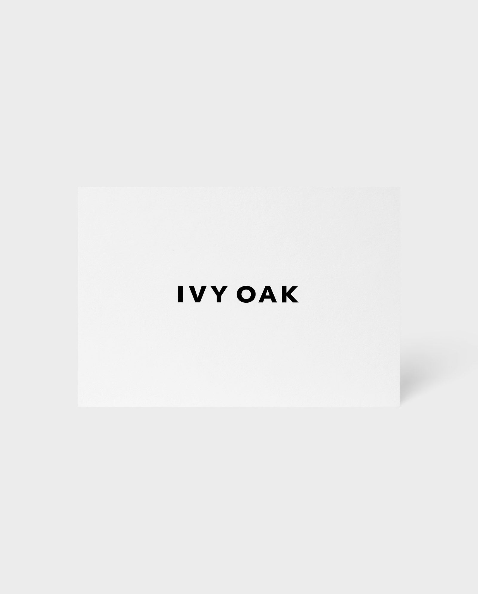 A white card displays TXEST PRODUCT in bold black letters, with the IVY OAK (DE) brand name centered on it.