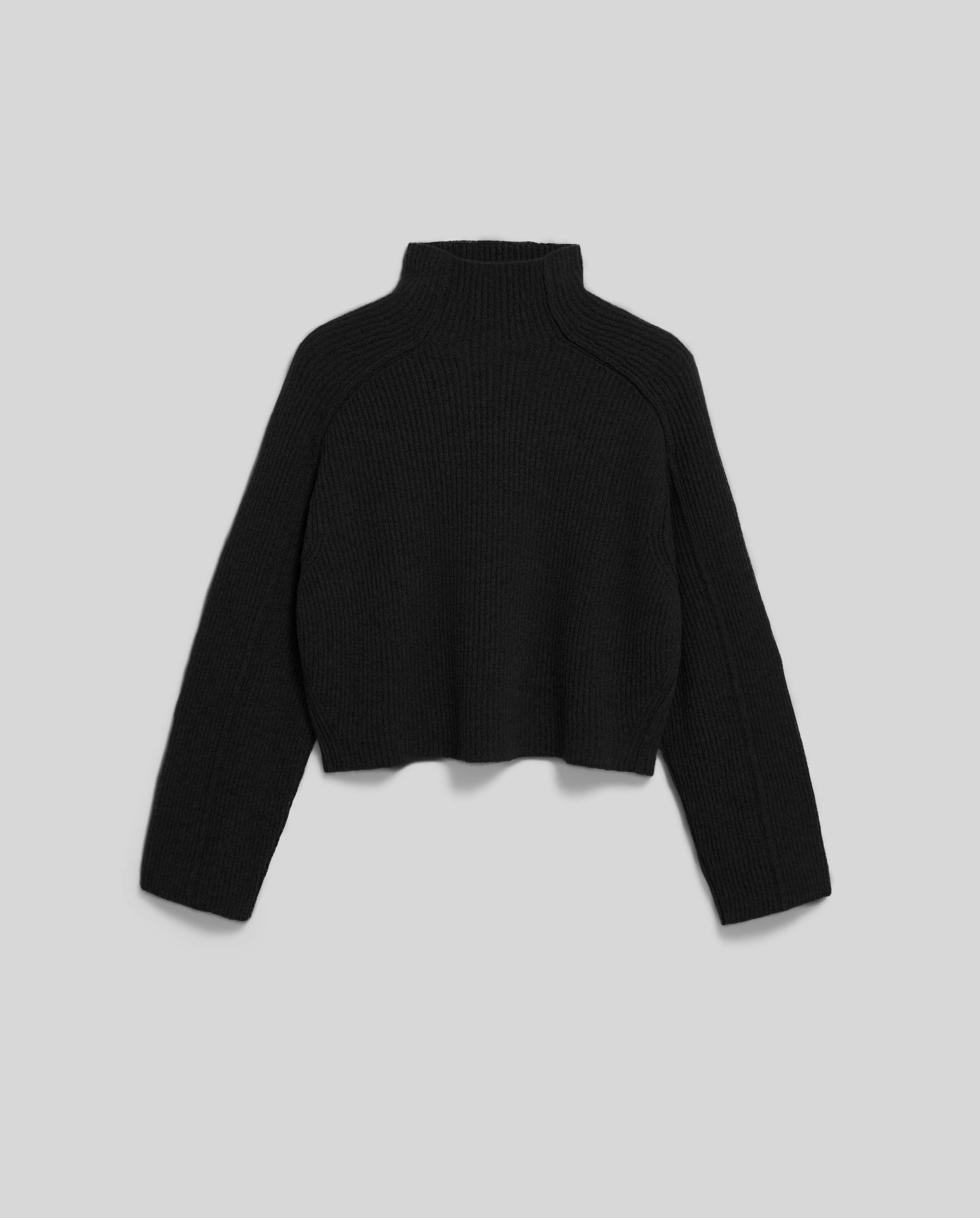 The KEEVA Jumper by IVY OAK is a black, long-sleeve rib knit sweater with a high neck and oversized fit, shown on a gray background.