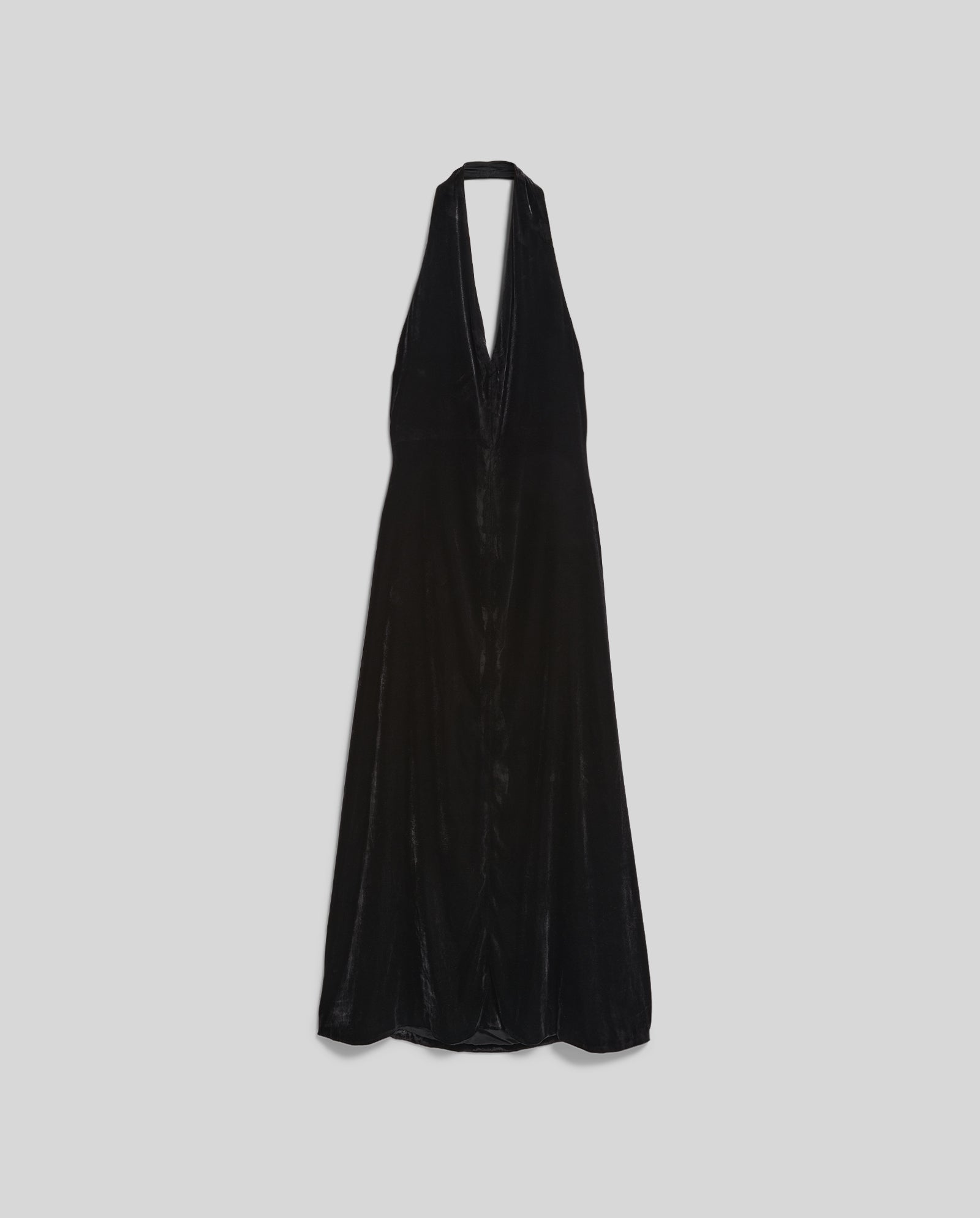 The NESTA ROSE Dress by IVY OAK is a black velvet halterneck dress featuring a deep V-neckline and zipper closure, shown on a plain light gray background.