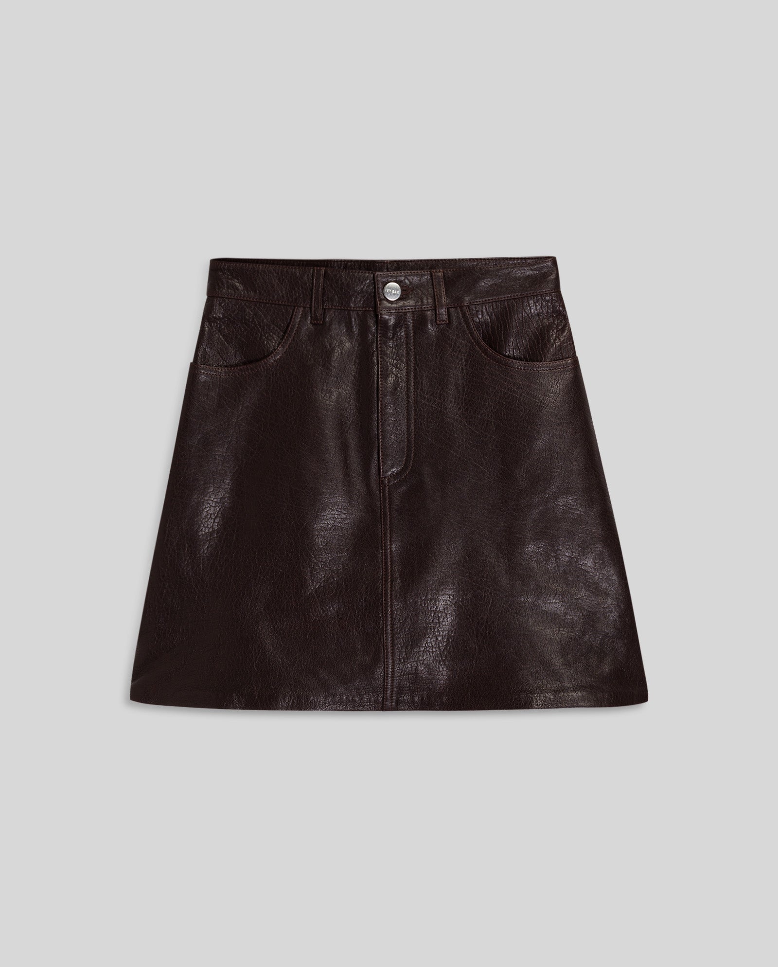 The IVY OAK LILOU Skirt is a dark brown leather mini skirt with an A-line silhouette, front pockets, and button closure, shown on a gray background.